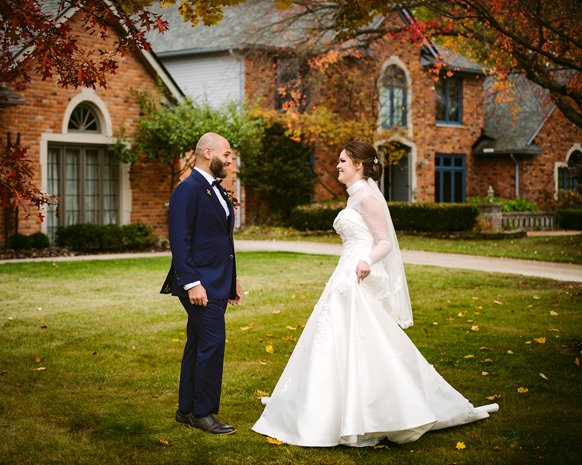 Detroit bride and groom sharing an emotional first look outdoors before their wedding ceremony